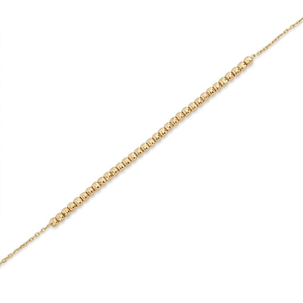 Pulsera de oro amarillo 14K con cuentas texturizadas y cadena fina