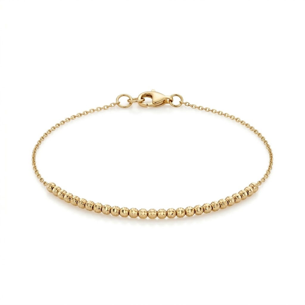 Pulsera de oro amarillo 14K con cuentas texturizadas y cadena fina